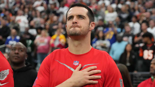 AFC quarterback Derek Carr of the Raiders (4) observes the playing of the national anthem during the Pro Bowl Games at Allegiant Stadium.
