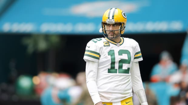 Green Bay Packers QB Aaron Rodgers stands on field