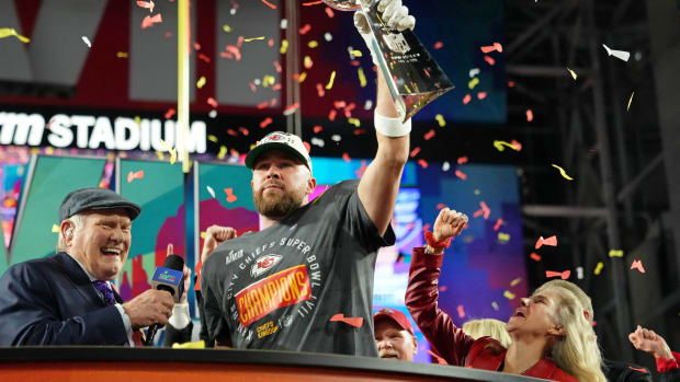 Feb 12, 2023; Glendale, Arizona, US; Kansas City Chiefs tight end Travis Kelce (87) holds the Vince Lombardi Trophy after winning Super Bowl LVII against the Philadelphia Eagles at State Farm Stadium. Mandatory Credit: Kirby Lee-USA TODAY Sports