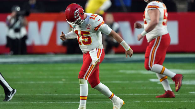 Chiefs quarterback Patrick Mahomes (15) reacts an apparent injury after a play in the second quarter of Super Bowl LVII at State Farm Stadium.