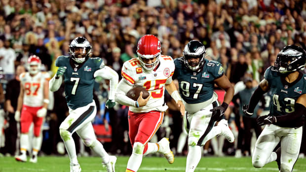 Patrick Mahomes runs for a first down as Eagles defenders give chase in the fourth quarter of Super Bowl LVII