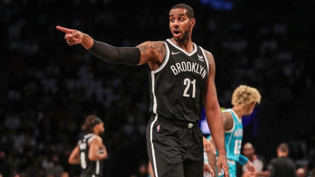 Nets forward/center LaMarcus Aldridge (21) points at an official in the first quarter of a game against the Hornets.