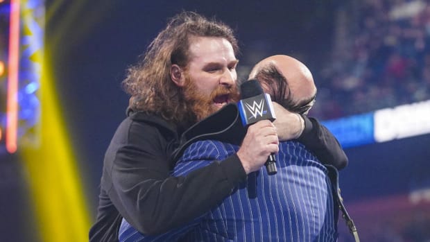 Sami Zayn hugs Paul Heyman on SmackDown