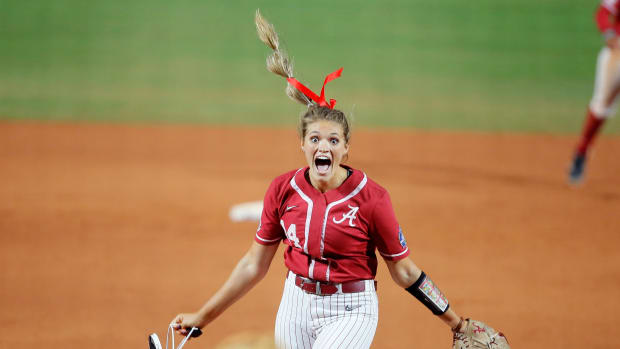 Alabama's Montana Fouts (14) celebrates after pitching a perfect game against UCLA in last June's Women's College World Series