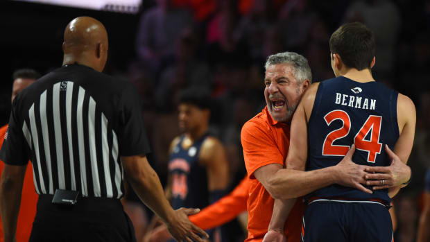 Feb 18, 2023; Nashville, Tennessee, USA; Auburn Tigers head coach Bruce Pearl grabs guard Lior Berman (24) to show the referee how his players were being fouled during the first half against the Vanderbilt Commodores at Memorial Gymnasium. Mandatory Credit: Christopher Hanewinckel-USA TODAY Sports