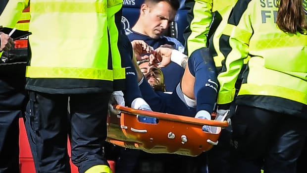 Neymar pictured leaving the field on a stretcher after suffering an ankle injury in PSG's Ligue 1 game against Lille in February 2023