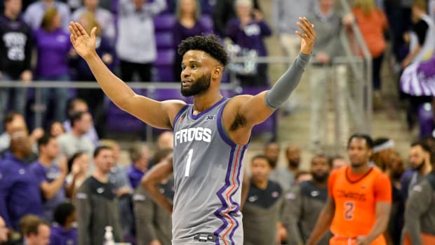 Feb 18, 2023; Fort Worth, Texas, USA; TCU Horned Frogs guard Mike Miles Jr. (1) celebrates the win over the Oklahoma State Cowboys at the Ed and Rae Schollmaier Arena.
