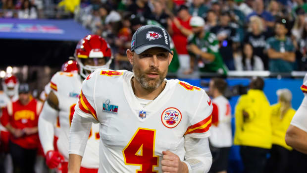 Chad Henne jogs onto the field before Super Bowl LVII
