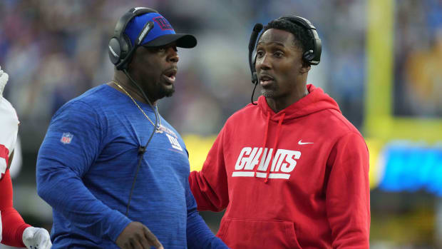Dec 12, 2021; Inglewood, California, USA; New York Giants defensive line coach Sean Spencer (left) and linebackers coach Anthony Blevins react during the game against the Los Angeles Chargers at SoFi Stadium.