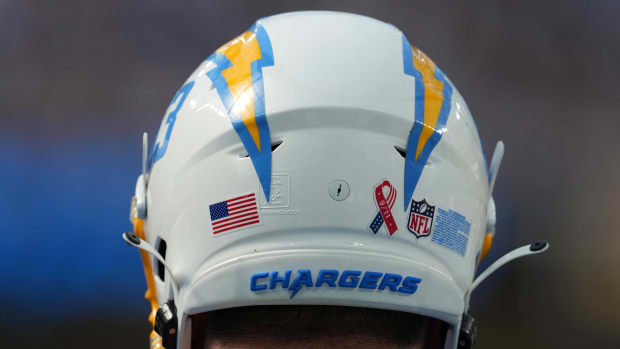 Sep 11, 2022; Inglewood, California, USA; A detailed view of the 9/11 ribbon logo on the back of the helmet of Los Angeles Chargers center Corey Linsley (63) during the game against the Las Vegas Raiders at SoFi Stadium. Mandatory Credit: Kirby Lee-USA TODAY Sports