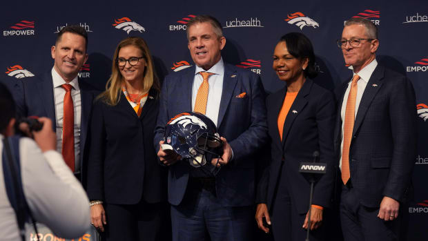 Denver Broncos head coach Sean Payton (center) poses general manager George Payton, owners Carrie Penner, Condoleezza Rice and Greg Penner following a press conference at the UCHealth Training Center.