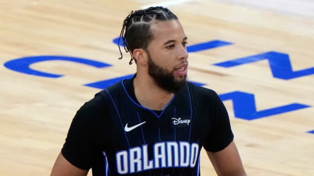 Magic guard Michael Carter-Williams dribbles the ball down the court during a game in 2021.