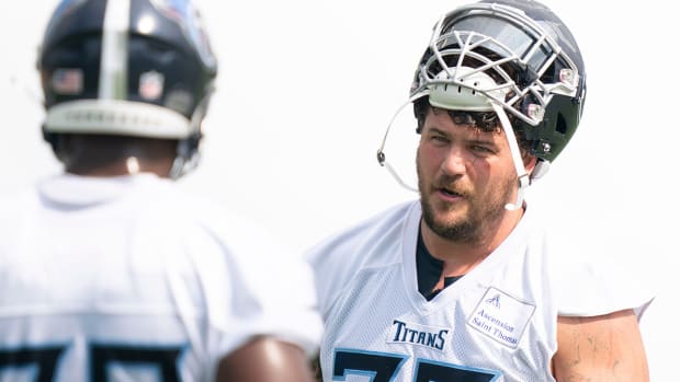 Titans offensive tackle Taylor Lewan (77) gives instruction to offensive lineman Nicholas Petit-Frere (78) during practice at Saint Thomas Sports Park.