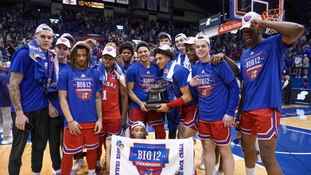 Feb 28, 2023; Lawrence, Kansas, USA; Kansas Jayhawks pose with the championship trophy after the win over the Texas Tech Red Raiders in which they clinched a share of the Big12 Conference Championship at Allen Fieldhouse. Mandatory Credit: Denny Medley-USA TODAY Sports