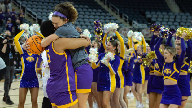 Tennessee Tech s DJ McFarlane (35) embraces Tennessee Tech s Peyton Carter (22) while celebrating the Golden Eagles 54-46 victory over the Little Rock Trojans in the OVC women’s championship at Ford Center on Saturday, March 4, 2023. Ns Ttu Lr 030423 0323