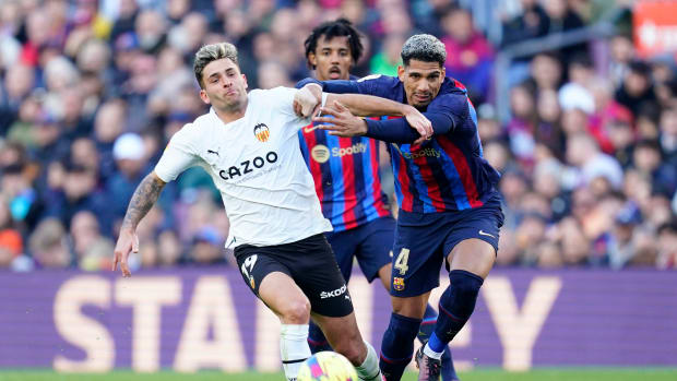 Ronald Araujo pictured (right) fouling Hugo Duro during Barcelona's 1-0 win over Valencia
