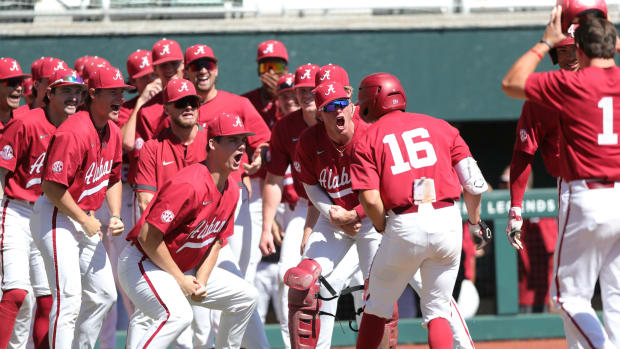 Alabama baseball players celebrate with Colby Shelton (16) following his grand slam in the victory at Sewell-Thomas Stadium against UIC on March 5, 2023.