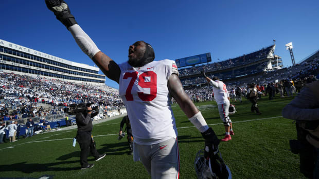 Oct 29, 2022; University Park, Pennsylvania, USA; Ohio State Buckeyes offensive linemen Dawand Jones (79) waves to the fans following the NCAA Division I football game against the Penn State Nittany Lions at Beaver Stadium. Ohio State won 41-33. Mandatory Credit: Adam Cairns-The Columbus Dispatch Ncaa Football Ohio State Buckeyes At Penn State Nittany Lions