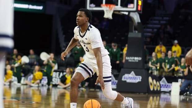 Oral Roberts guard Max Abmas dribbles the ball up the court against North Dakota State