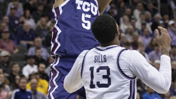 Mar 9, 2023; Kansas City, MO, USA; Texas Christian Horned Frogs forward Chuck O'Bannon Jr. (5) shoots the ball over Kansas State Wildcats guard Desi Sills (13) in the first half at T-Mobile Center.