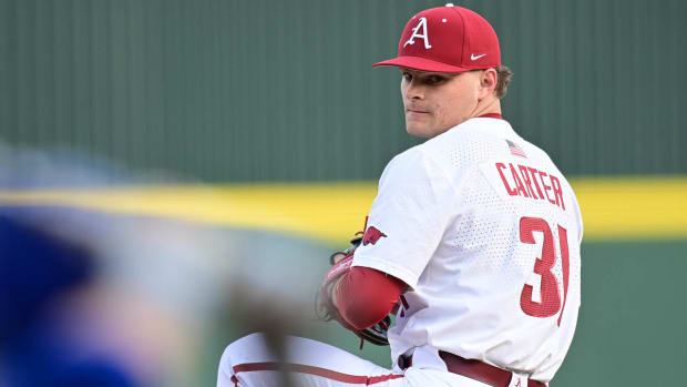 Razorbacks relief pitcher Dylan Carter delivering a pitch against Louisiana Tech on Friday afternoon.