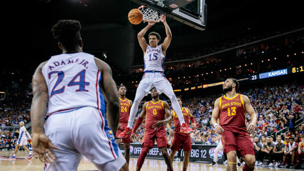 Mar 10, 2023; Kansas City, MO, USA; Kansas Jayhawks guard Kevin McCullar Jr. (15) dunks during the first half against the Iowa State Cyclones at T-Mobile Center.