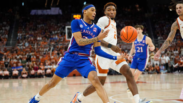 Mar 4, 2023; Austin, Texas, USA; Kansas Jayhawks guard Dajuan Harris Jr. (3) loses control of the ball while driving to the basket past Texas Longhorns guard Arterio Morris (2) during the second half at Moody Center. Mandatory Credit: Scott Wachter-USA TODAY Sports