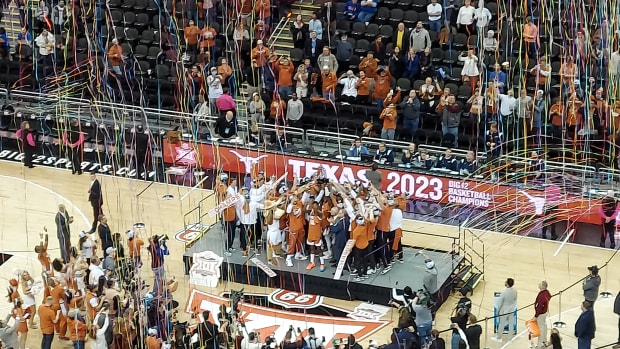 The Texas Longhorns celebrate winning the Phillips 66 Big 12 Championship at T-Mobile Center in Kansas City.