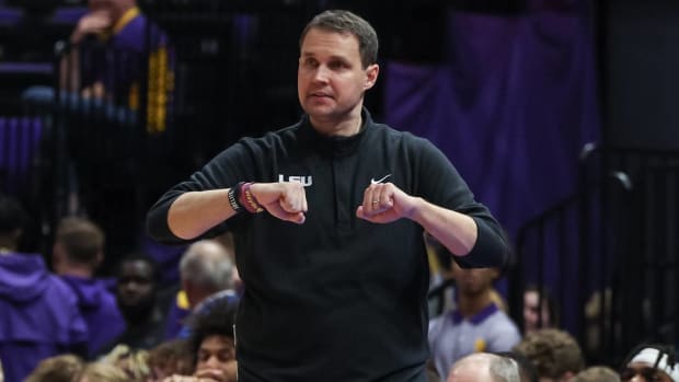 LSU head coach Will Wade signals to his team during a game.