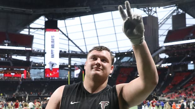 Falcons guard Chris Lindstrom (63) reacts after they defeated the Jaguars at Mercedes-Benz Stadium.