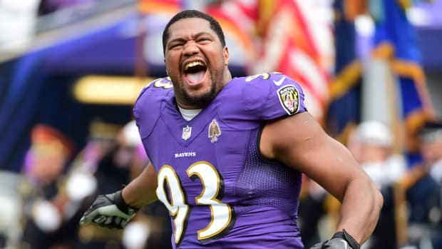 Ravens defensive tackle Calais Campbell comes onto the field before a game in 2021.