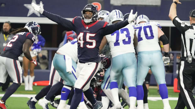 Dec 11, 2022; Arlington, Texas, USA; Houston Texans linebacker Ogbonnia Okoronkwo (45) reacts after a turnover by the Dallas Cowboys during the second half at AT&T Stadium. Mandatory Credit: Raymond Carlin III-USA TODAY Sports