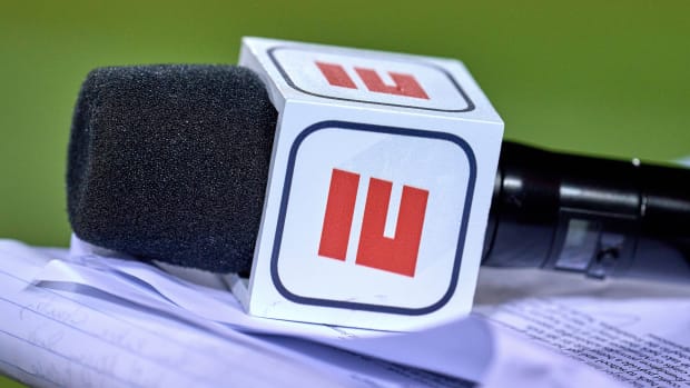 A detailed view of a microphone is seen with an ESPN logo on it during a game between the Bears and the Vikings.