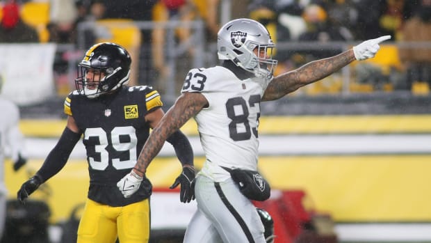 Las Vegas Raiders Darren Waller (83) signals for a first down as Pittsburgh Steelers Minkah Fitzpatrick (39) says it was incomplete during the first half at Acrisure Stadium in Pittsburgh, PA on December 24, 2022.