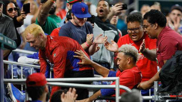 Mar 15, 2023; Miami, Florida, USA; Puerto Rico pitcher Edwin Diaz (39) leaves the field on a wheelchair after an apparent leg injury during the team celebration against Dominican Republic at LoanDepot Park.
