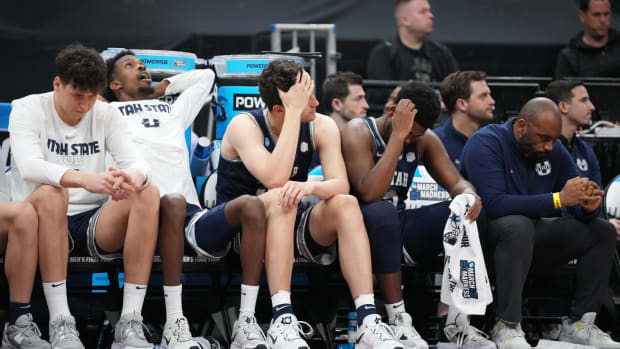 Mar 16, 2023; Sacramento, CA, USA; Utah State Aggies bench reacts during the second half at Golden 1 Center.