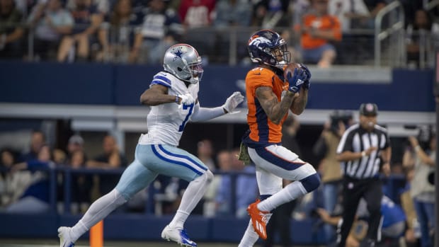 Nov 7, 2021; Arlington, Texas, USA; Denver Broncos wide receiver Tim Patrick (81) catches as a pass as Dallas Cowboys cornerback Trevon Diggs (7) defends during the second half at AT&T Stadium.