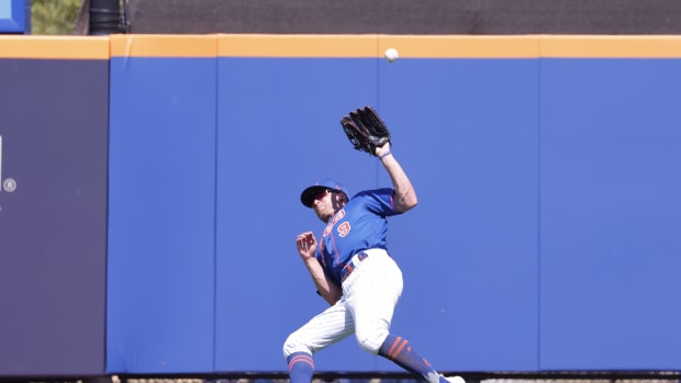 Mar 12, 2023; Port St. Lucie, Florida, USA; New York Mets center fielder Brandon Nimmo (9) loses a fly ball in the sun during the fourth inning against the Tampa Bay Rays at Clover Park.