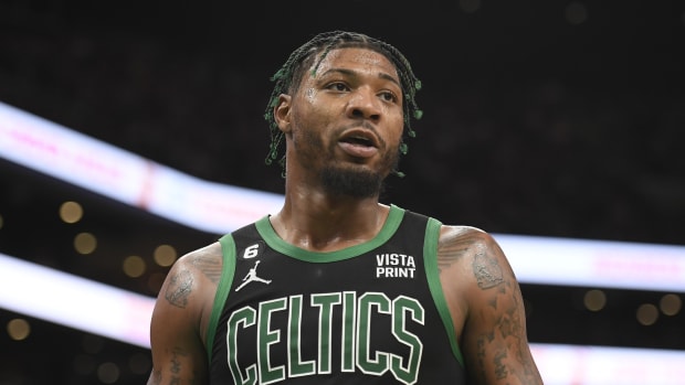 Boston Celtics guard Marcus Smart (36) interacts with the referee during the second half against the Brooklyn Nets at TD Garden.