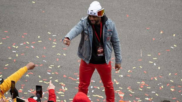 Chiefs safety Juan Thornhill shows off his ring to fans at the Super Bowl LVII Champions Parade in downtown Kansas City.