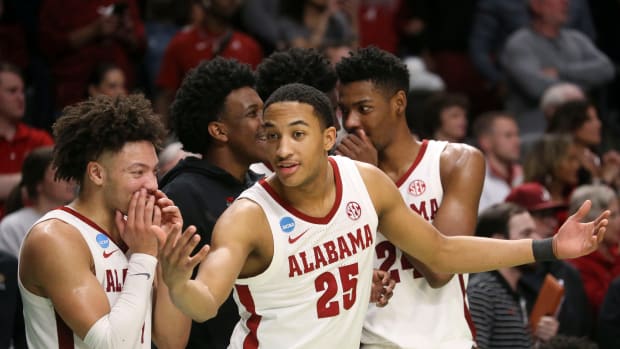 Mar 18, 2023; Birmingham, AL, USA; Alabama guard Mark Sears (1) and Alabama guard Nimari Burnett (25) enjoy the final minutes of the Crimson Tide s win over Maryland at Legacy Arena during the second round of the NCAA Tournament. Alabama advanced to the Sweet Sixteen with a 73-51 win over Maryland.