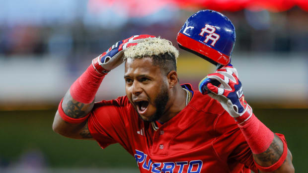 Mar 17, 2023; Miami, Florida, USA; Puerto Rico right fielder Nelson Velazquez (40) reacts from first base after hitting a single during the first inning against Mexico at LoanDepot Park. Mandatory Credit: Sam Navarro-USA TODAY Sports