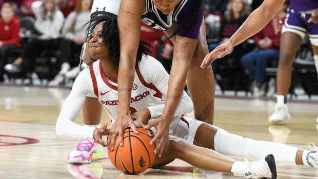 Razorbacks Samara Spencer driving for a loose ball in a win over Stephen F. Austin on Monday night.