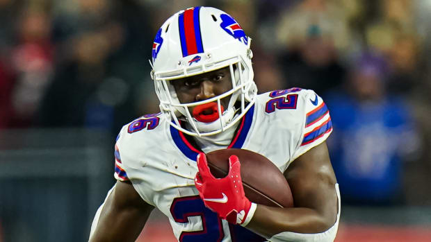 Bills running back Devin Singletary runs with the ball during a game.