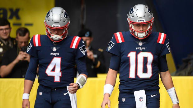 Nov 6, 2022; Foxborough, Massachusetts, USA; New England Patriots quarterback Bailey Zappe (4) and quarterback Mac Jones (10) walk onto the field prior to a game against the Indianapolis Colts at Gillette Stadium.