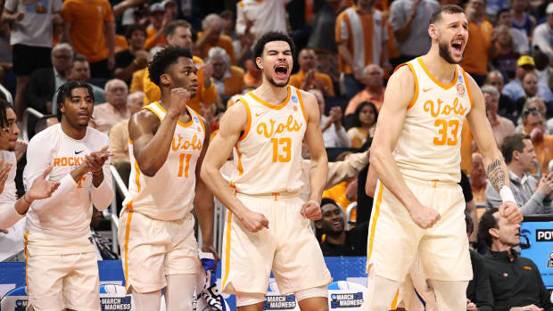 Tennessee forward sUros Plavsic (33) and Olivier Nkamhoua (13) celebrate from the bench during the first half of their game against Duke in the second round of the 2023 NCAA Tournament.