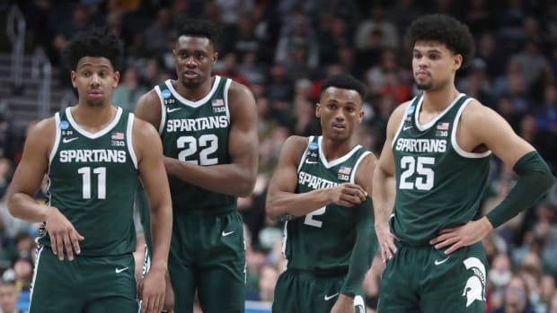 Michigan State men’s basketball players A.J. Hoggard, Mady Sissoko, Tyson Walker and Malik Hal wait for play to begin during the 2023 NCAA men’s tournament Round of 32 game.