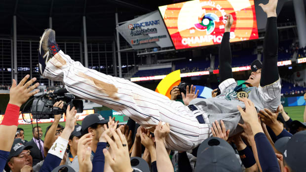 Shohei Ohtani is lifted by his Team Japan teammates to celebrate World Baseball Classic win