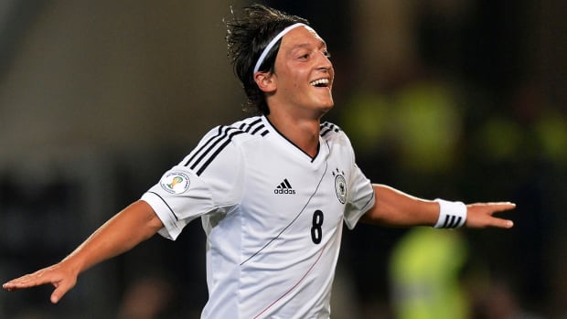 Germany midfielder Mesut Özil celebrates after scoring during the Brazil World Cup 2014 group C qualifying soccer match between Germany and Faroe Islands.