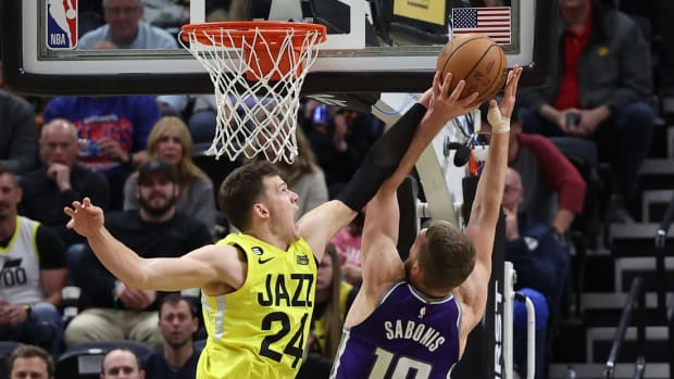 Utah Jazz center Walker Kessler (24) blocks the shot of Sacramento Kings forward Domantas Sabonis (10) in the fourth quarter at Vivint Arena.